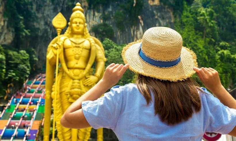 Kuala Lumpur Day Tour: Batu Caves & Elephant Sanctuary - Batu Caves and the 42.7m Golden Lord Murugan Moment