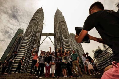 Private KL City Tour with Petronas Twin Towers & Batu Caves - Batu Caves: Lord Muruga, temple caves, and the step-count reality
