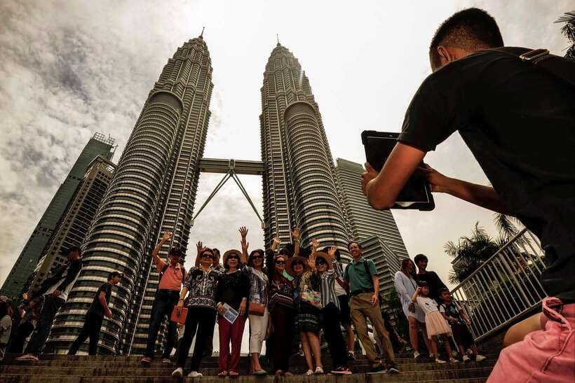 Private KL City Tour with Petronas Twin Towers & Batu Caves - Batu Caves: Lord Muruga, temple caves, and the step-count reality